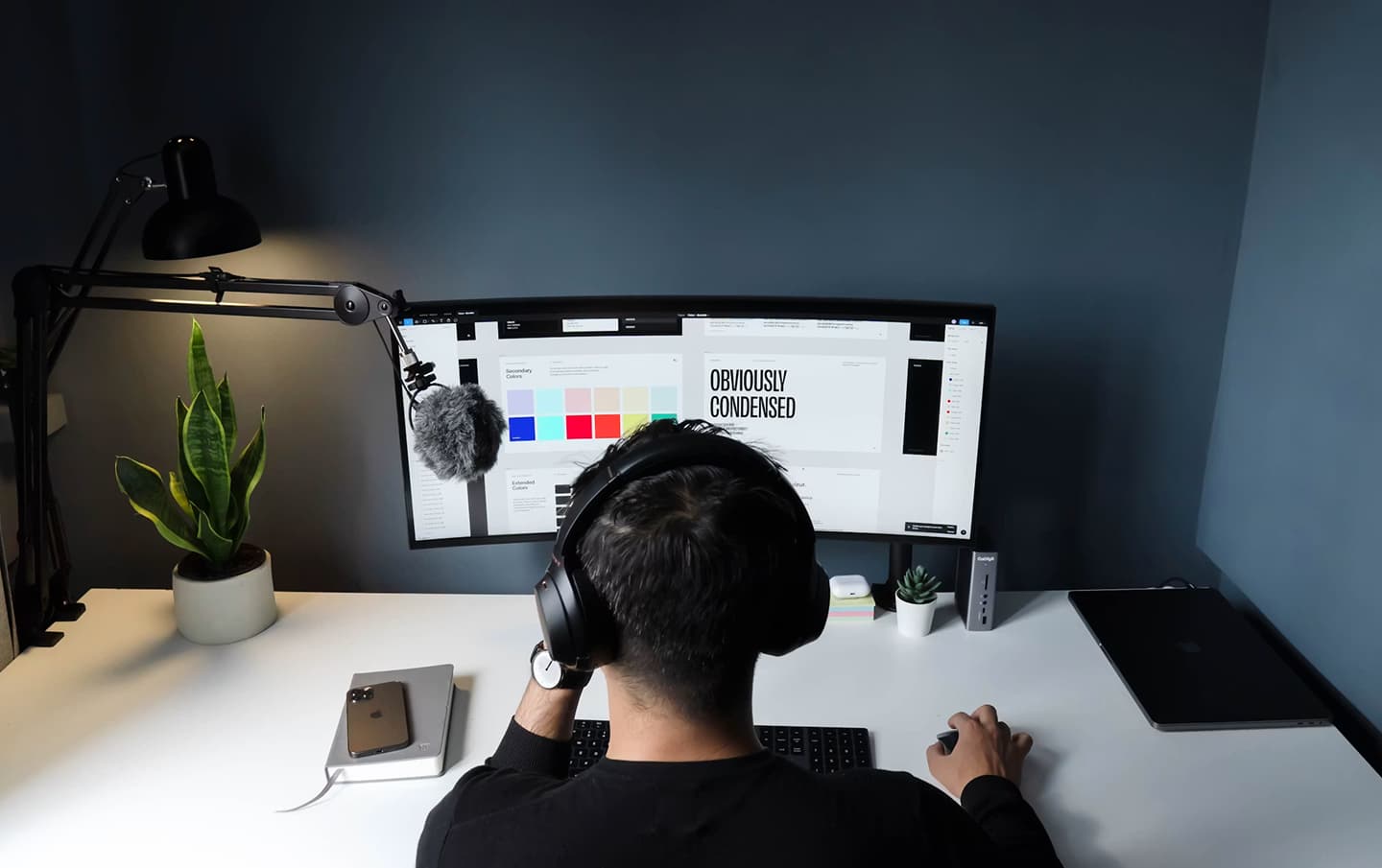 Tidy studio desk with dual monitors representing a small creative studio